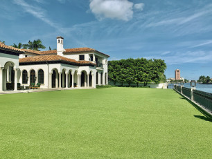 Sunny Pool Area and Lush Front Lawn by ForeverLawn Palm Beach