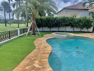 Sunny Pool Area by ForeverLawn Palm Beach