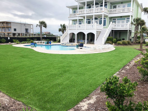 Beautiful Back Yard Pool Area by ForeverLawn Coastal Carolinas