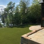 Putnam Station, NY, winter home backyard featuring GolfGreens® Pro Putt & Chip and DuPont™ ForeverLawn® Select EL