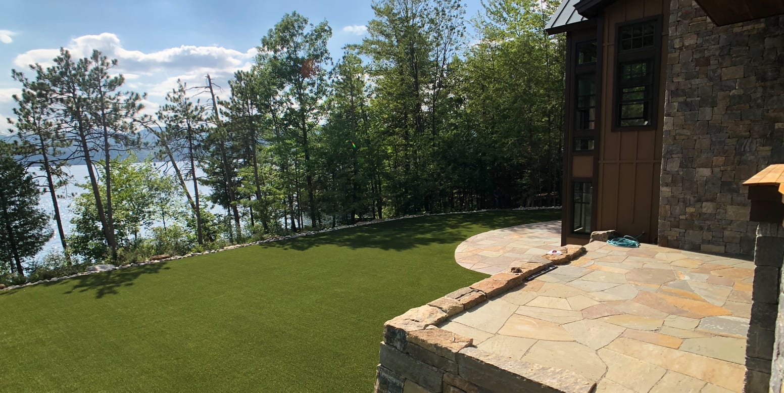 Putnam Station, NY, winter home backyard featuring GolfGreens® Pro Putt & Chip and DuPont™ ForeverLawn® Select EL