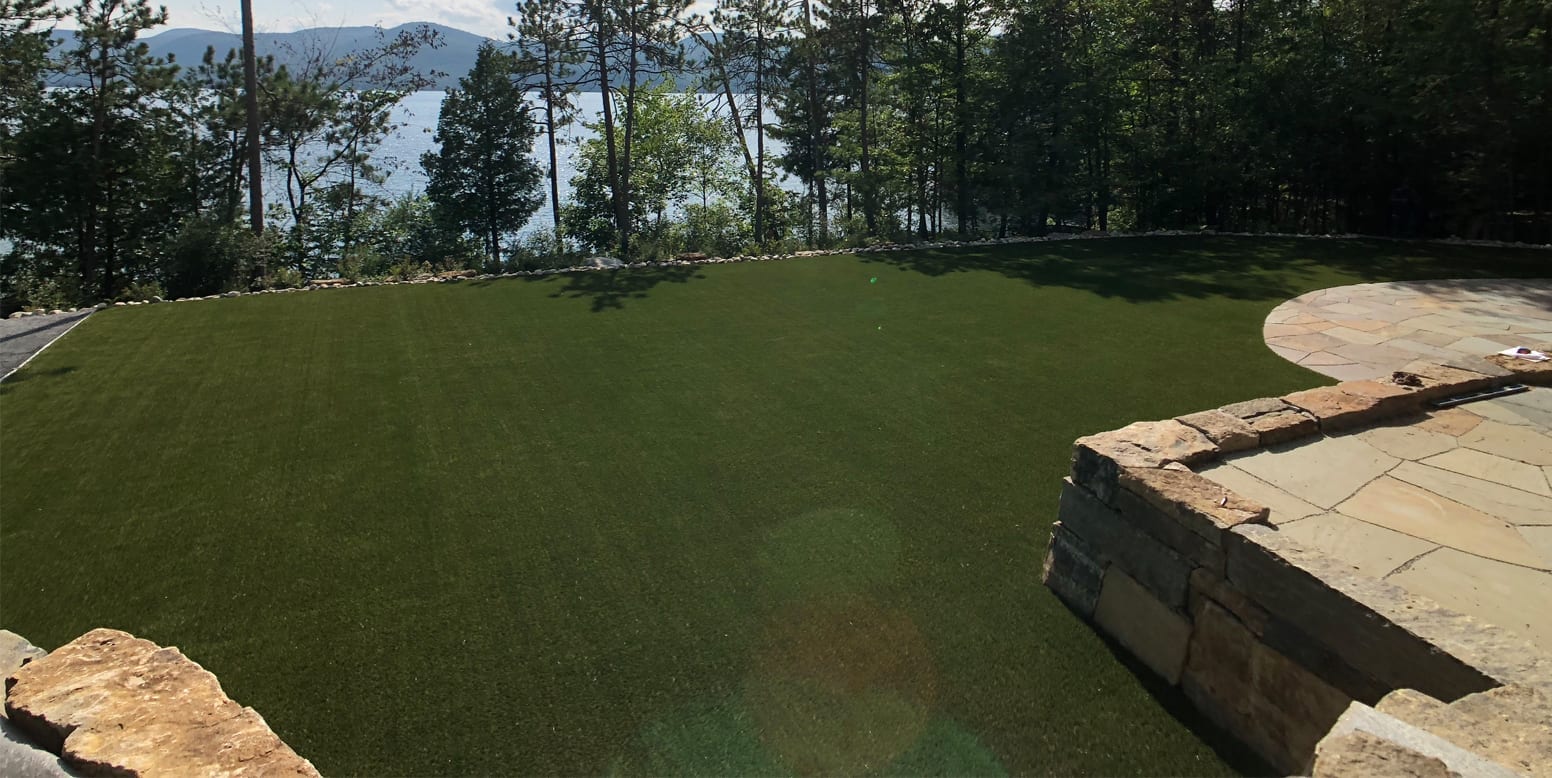 Putnam Station, NY, winter home backyard featuring GolfGreens® Pro Putt & Chip and DuPont™ ForeverLawn® Select EL