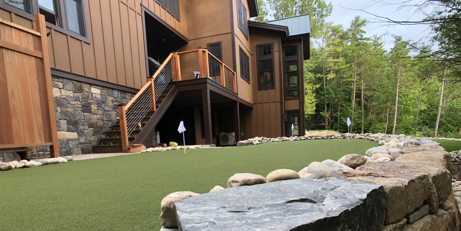 Putnam Station, NY, winter home backyard featuring GolfGreens® Pro Putt & Chip and DuPont™ ForeverLawn® Select EL