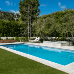 Jessica Capshaw and Christopher Gavigan’s backyard pool surrounded by ForeverLawn Fusion