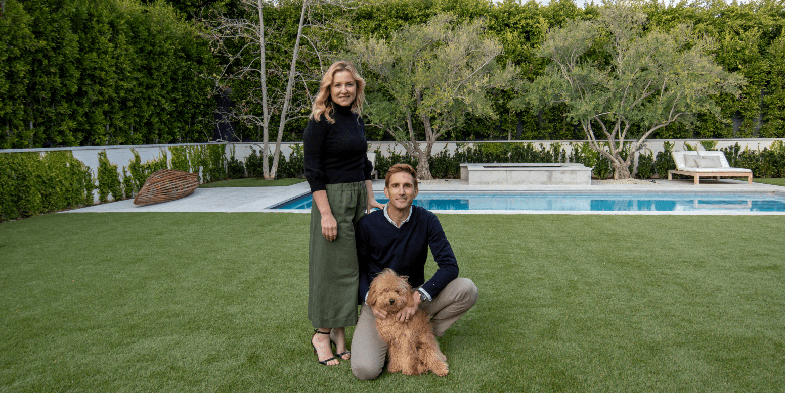 Jessica Capshaw and Christopher Gavigan in their backyard featuring ForeverLawn Fusion