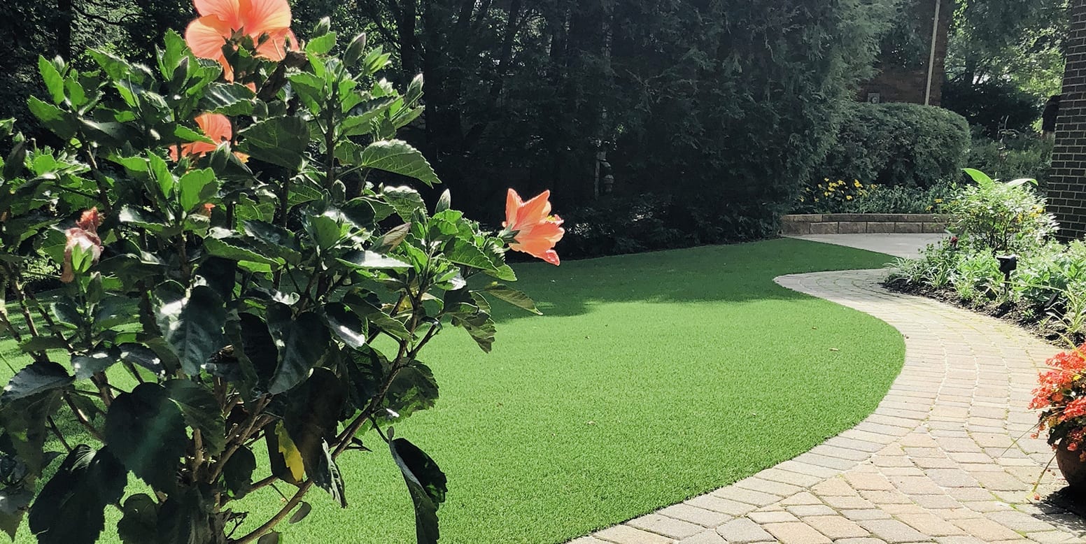 Residential backyard in Youngstown, Ohio, featuring DuPont™ ForeverLawn® Select LX