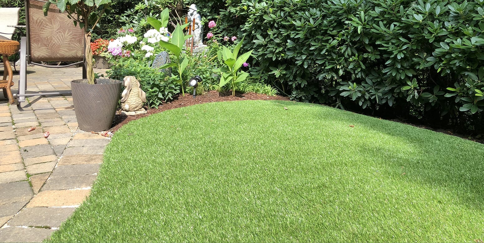 Residential backyard in Youngstown, Ohio, featuring DuPont™ ForeverLawn® Select LX