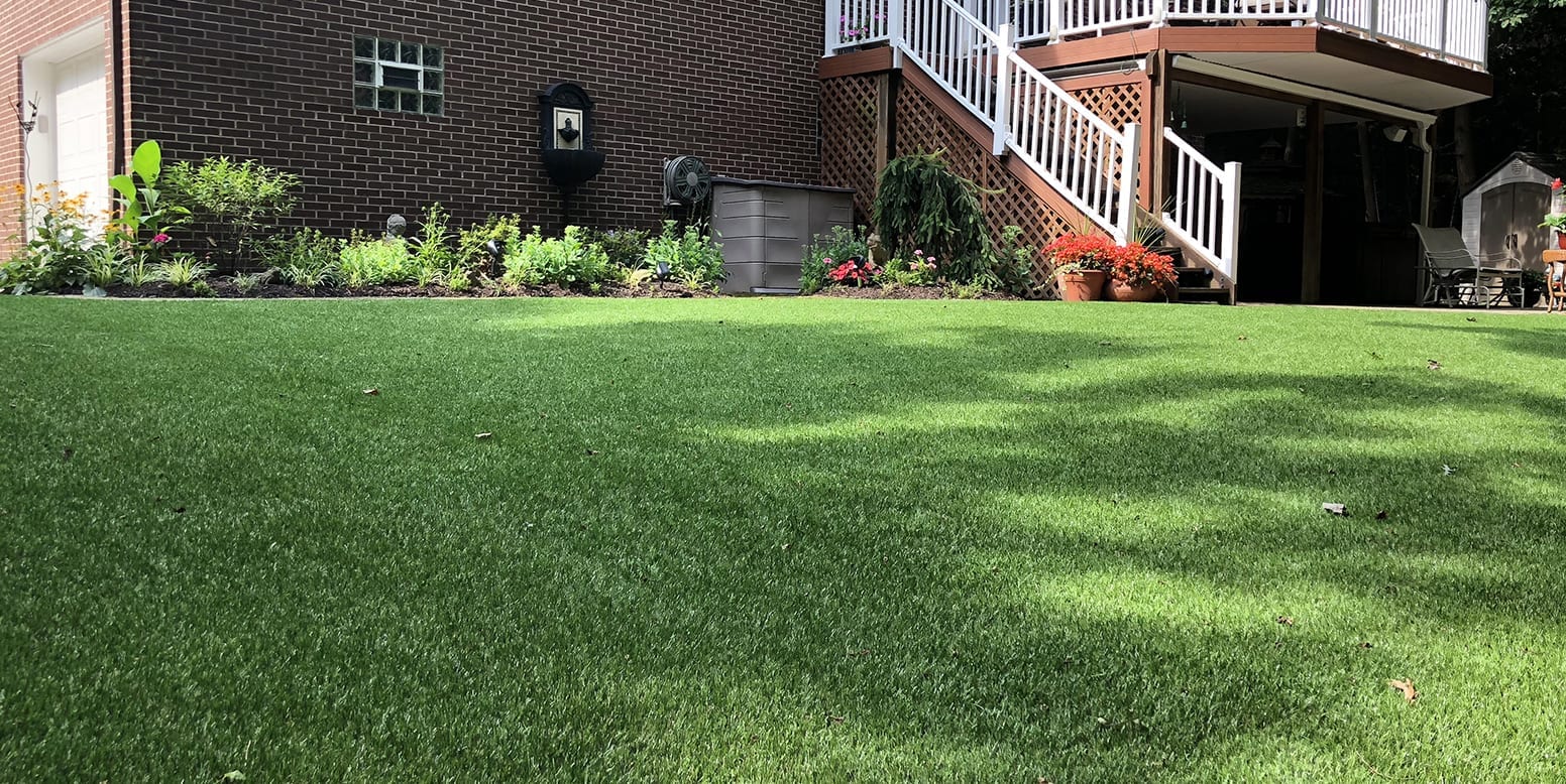 Residential backyard in Youngstown, Ohio, featuring DuPont™ ForeverLawn® Select LX