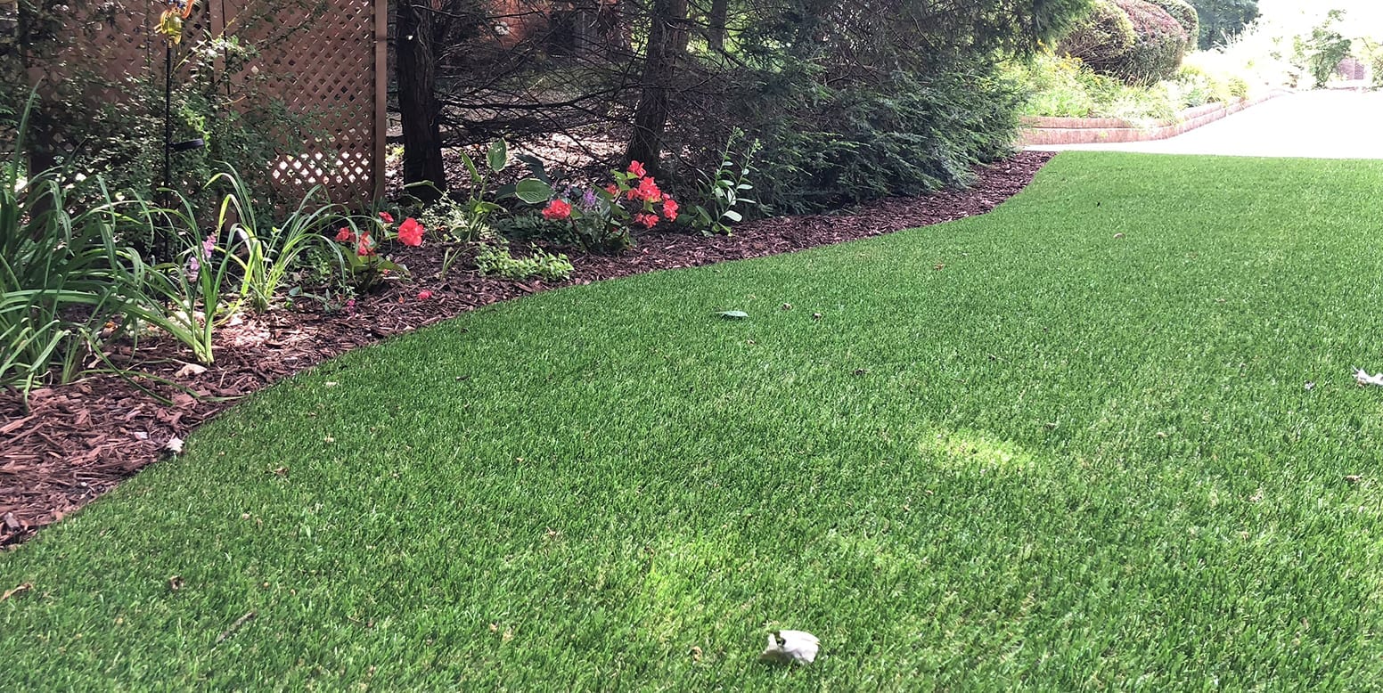 Residential backyard in Youngstown, Ohio, featuring DuPont™ ForeverLawn® Select LX