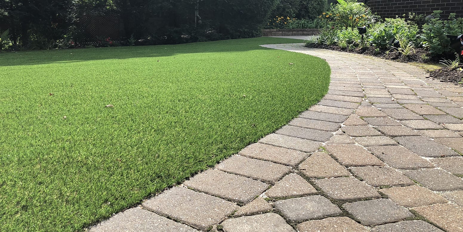 Residential backyard in Youngstown, Ohio, featuring DuPont™ ForeverLawn® Select LX