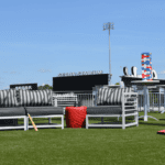 Lounge area at Segra Stadium featuring ForeverLawn Fusion Pro artificial grass.