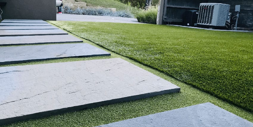 Residential outdoor entertainment space in Cranberry, PA, featuring ForeverLawn artificial grass
