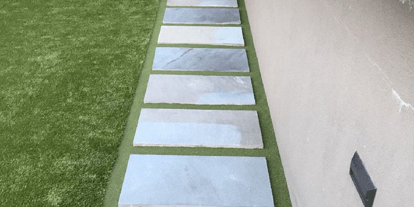 Residential outdoor entertainment space in Cranberry, PA, featuring ForeverLawn artificial grass