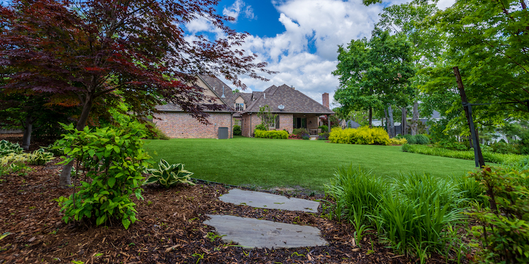 Largent residence backyard featuring ForeverLawn Landscape synthetic grass