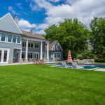 Downs residence backyard with pool featuring ForeverLawn synthetic grass installed by ForeverLawn Tulsa