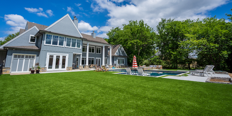 Downs residence backyard with pool featuring ForeverLawn synthetic grass installed by ForeverLawn Tulsa