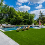 Downs residence backyard with pool featuring ForeverLawn synthetic grass installed by ForeverLawn Tulsa