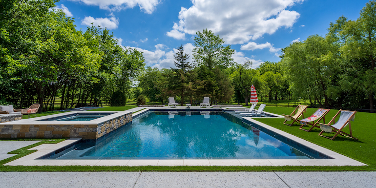 Downs residence backyard with pool featuring ForeverLawn synthetic grass installed by ForeverLawn Tulsa