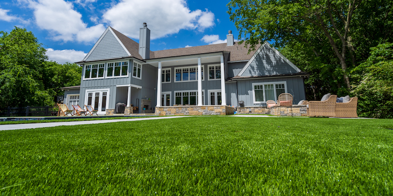 Downs residence backyard with pool featuring ForeverLawn synthetic grass installed by ForeverLawn Tulsa