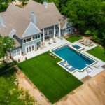 Downs residence backyard with pool featuring ForeverLawn synthetic grass installed by ForeverLawn Tulsa