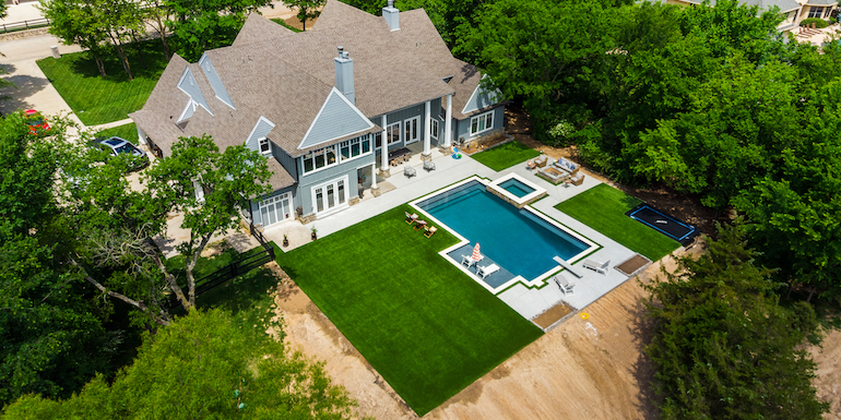 Downs residence backyard with pool featuring ForeverLawn synthetic grass installed by ForeverLawn Tulsa