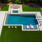 Downs residence backyard with pool featuring ForeverLawn synthetic grass installed by ForeverLawn Tulsa