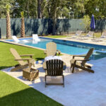 Ultra realistic and durable Fusion™ synthetic grass in a backyard pool area in Charleston